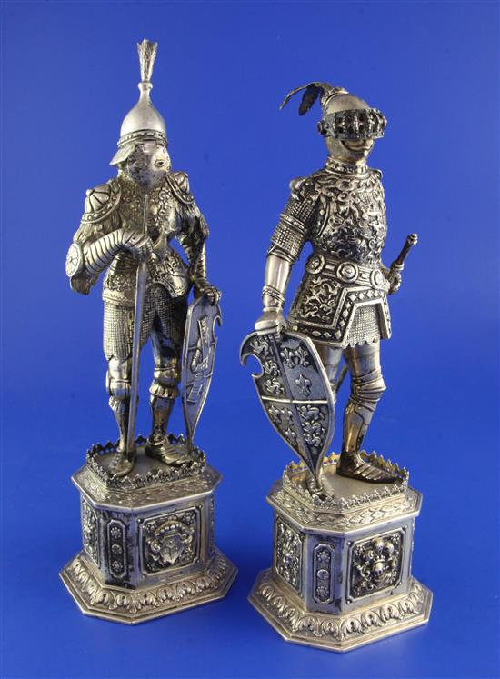 A pair of early 20th century German parcel gilt silver and carved ivory figures, modelled as Knights, gross 47 oz.